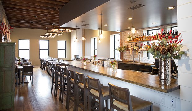 The Russell's on Macklind is a top St Louis breakfast spot. Interior image of second floor with bar and additional seating