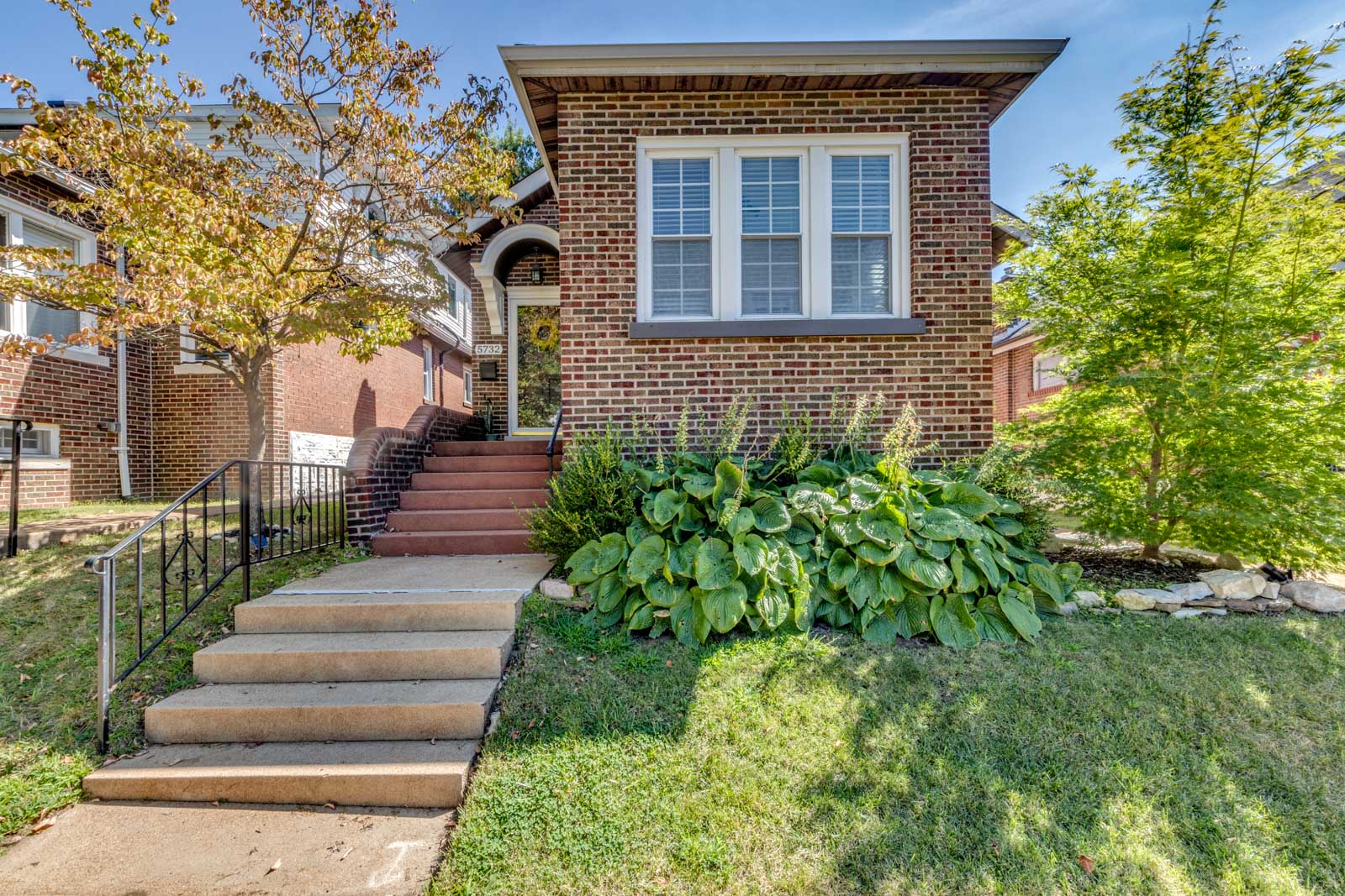 Charming 3-bedroom brick home in Bevo Mill with modern updates, spacious great room, and large backyard deck